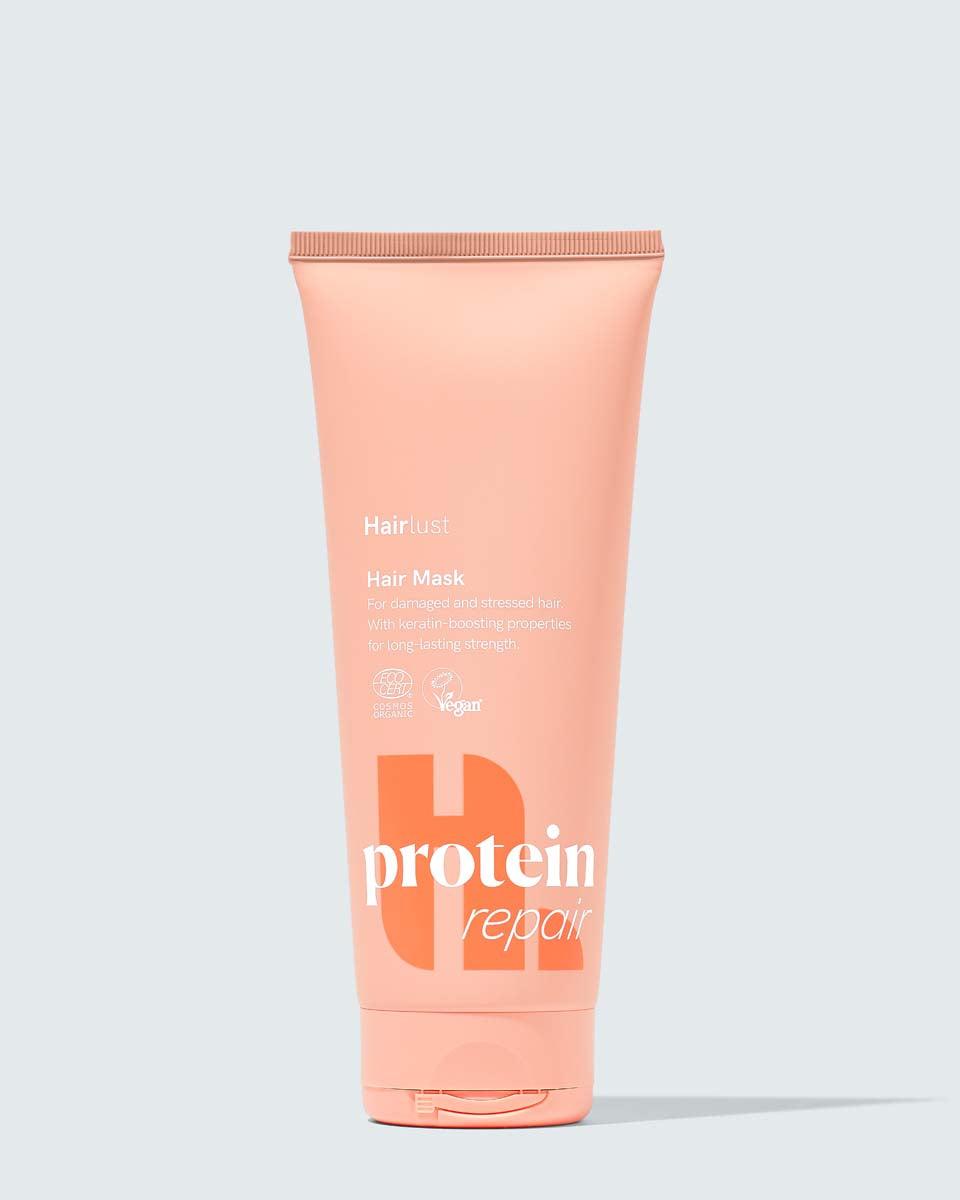 Hairlust Protein Repair Hair Mask i hvit og blå beholder